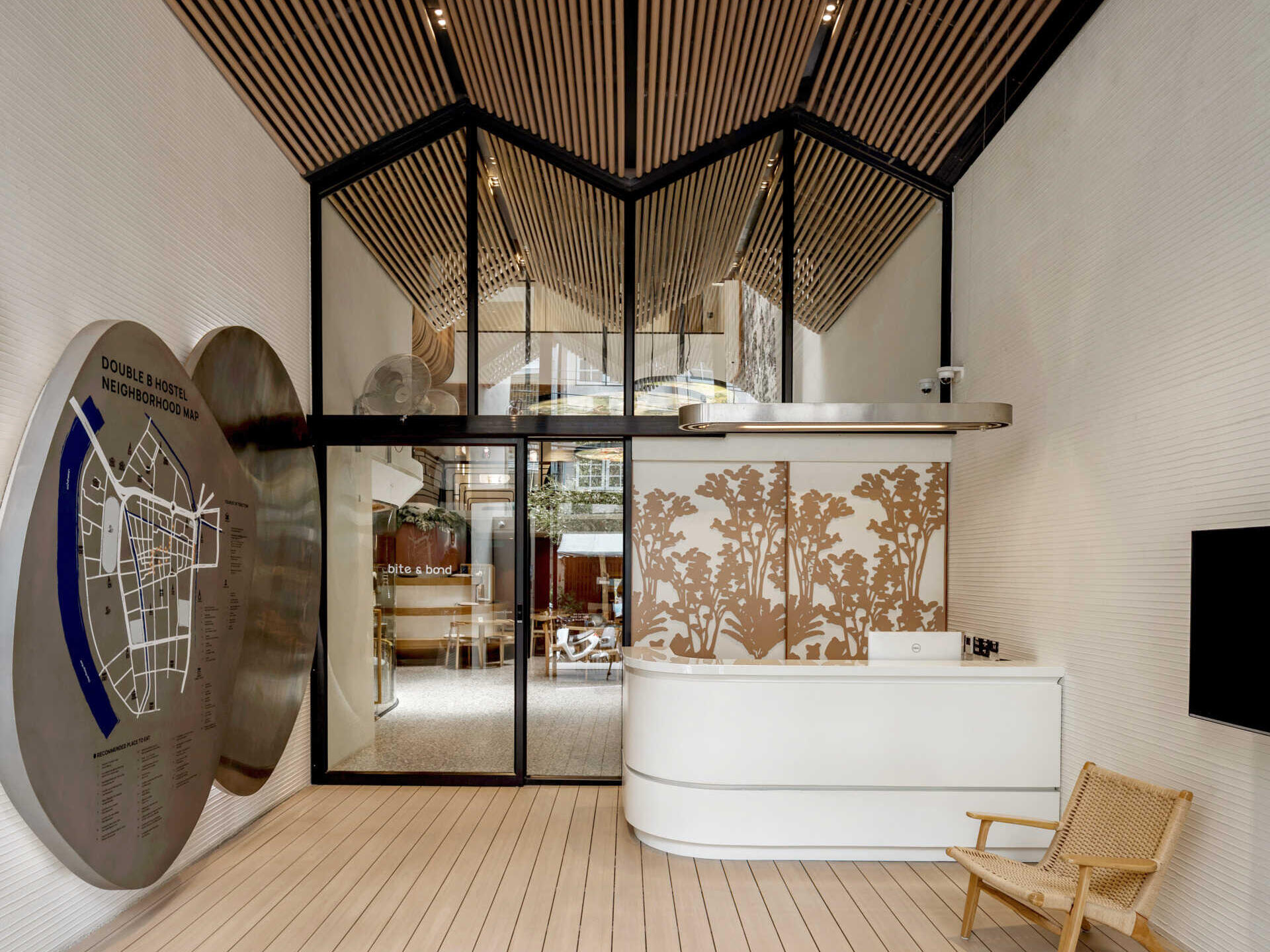 Inside the reception, warm reclaimed timber and natural light create a welcoming space that reflects the hostel’s connection to local artisans and heritage.