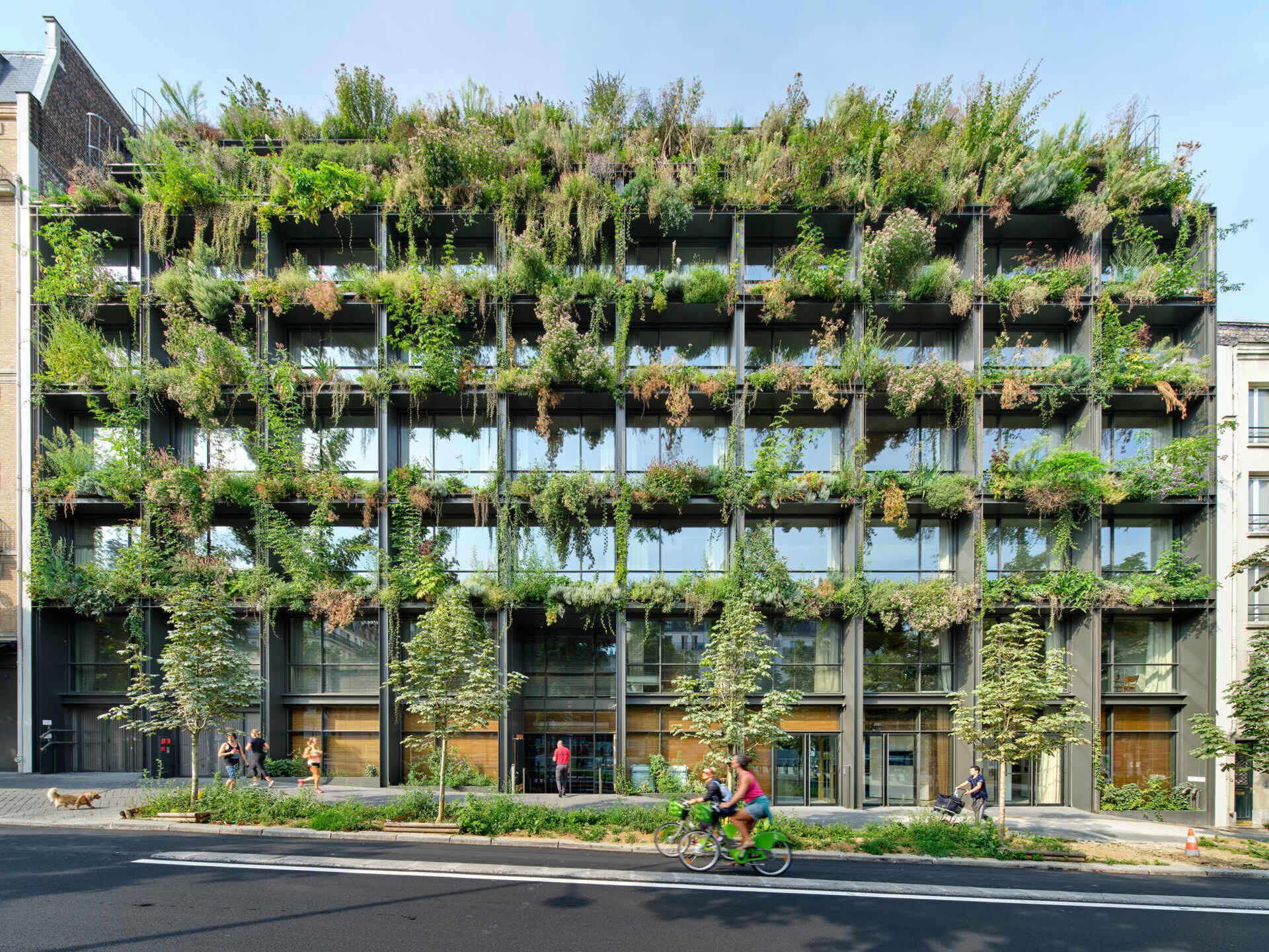  A striking vertical garden wraps the entire façade of Villa M in Paris, transforming the building into a living, breathing ecosystem. Designed as an exoskeleton of greenery, it blends architecture and nature in a bold vision for urban sustainability.