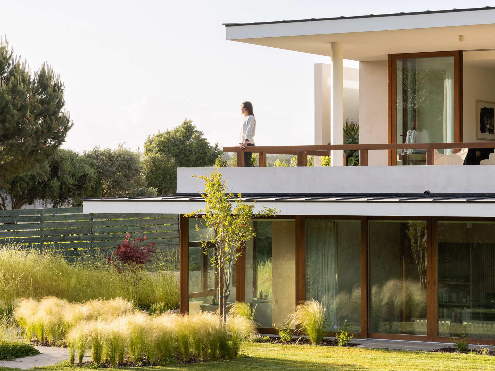 This hillside home uses the natural slope to its advantage. Half-buried and minimal in form, it blends seamlessly with its environment.