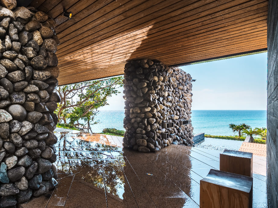 A’tolan House on Taiwan’s east coast is named for the rocks that shaped it, with walls and terraces built from stones excavated onsite.