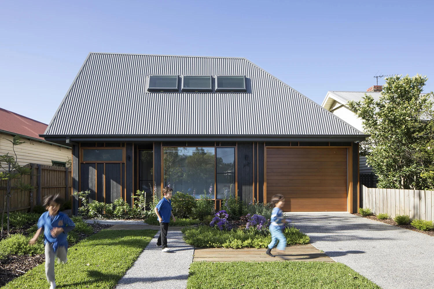 A sculptural twist on the classic suburban roofline gives this Melbourne home a modern identity while staying true to its neighborhood charm.