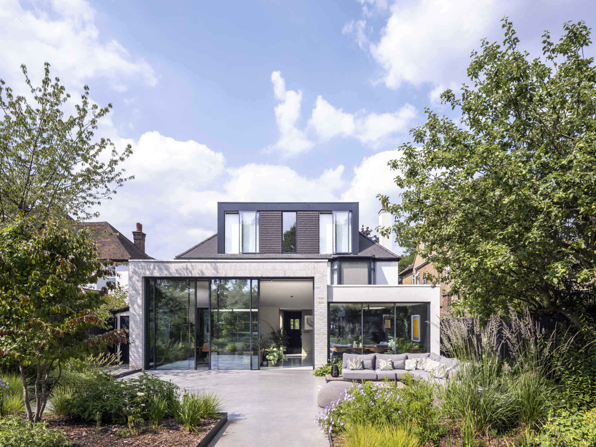 The new extension floods the home with daylight, creating a seamless link between the house and garden.