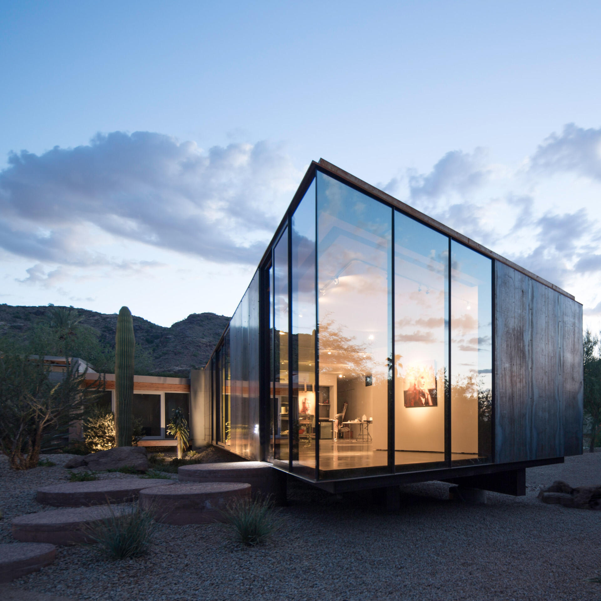 Weathering steel and glass give this Arizona art studio a bold yet restrained presence in the desert.