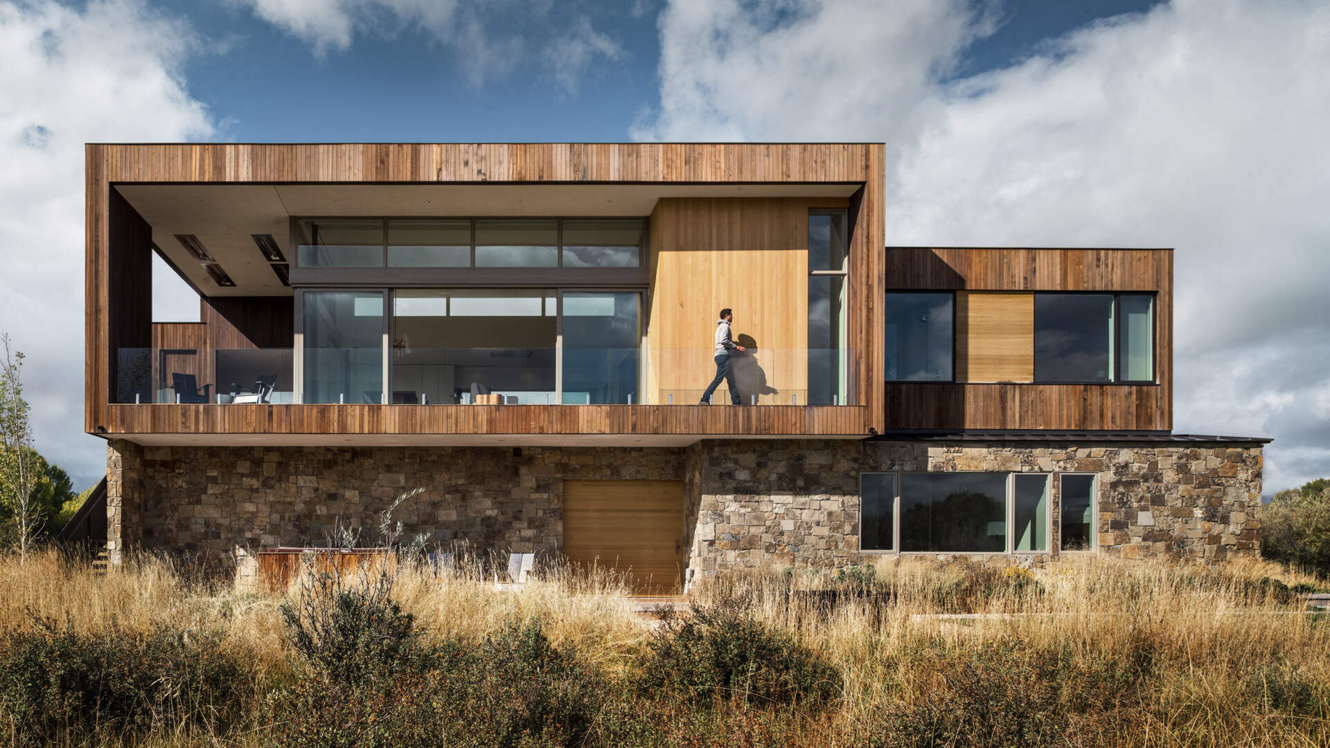 Earthen rock and stained wood connect this contemporary home to its natural Idaho surroundings.