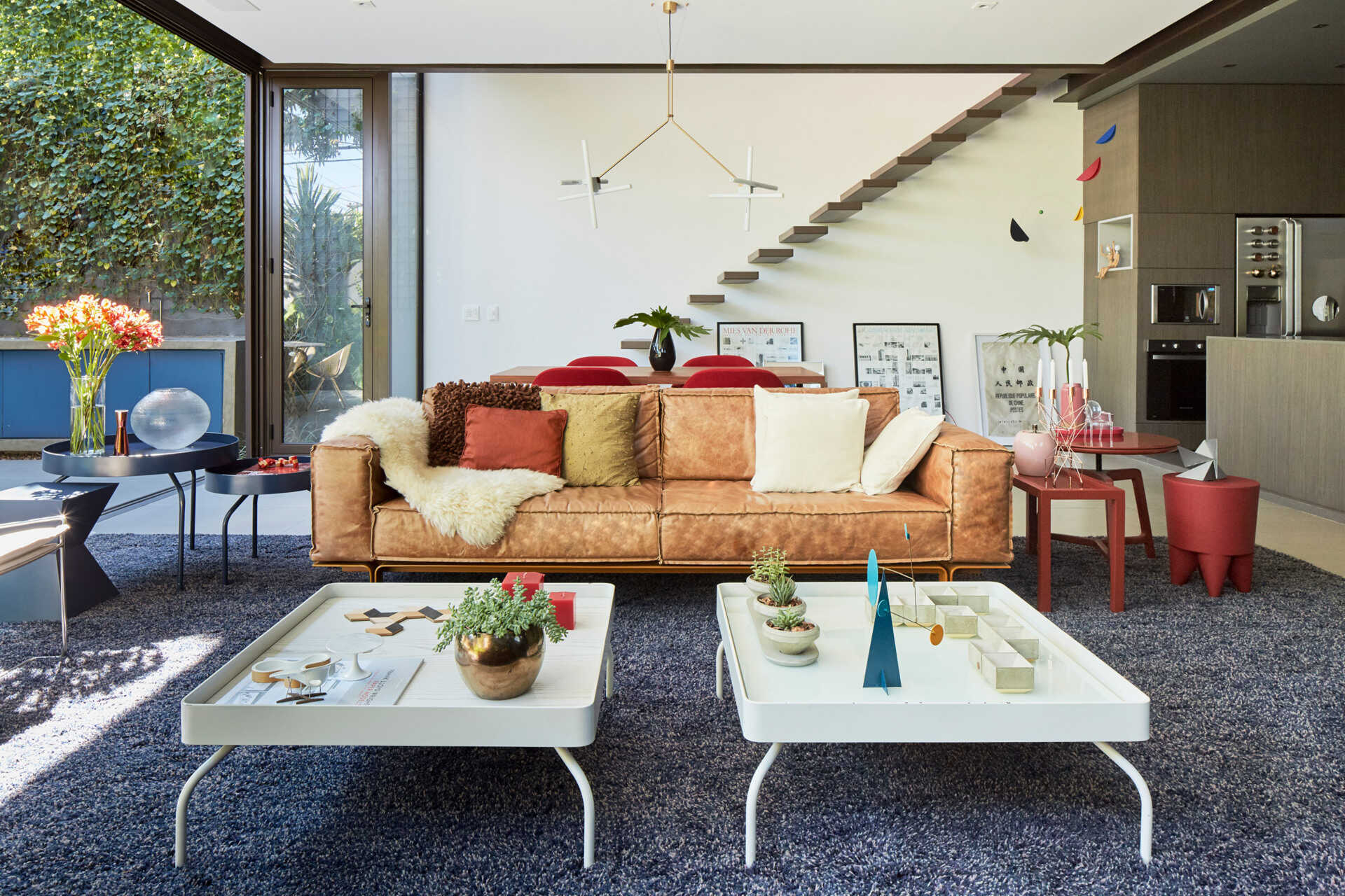 Sliding glass doors blur the line between inside and out, creating a relaxed indoor outdoor living space.