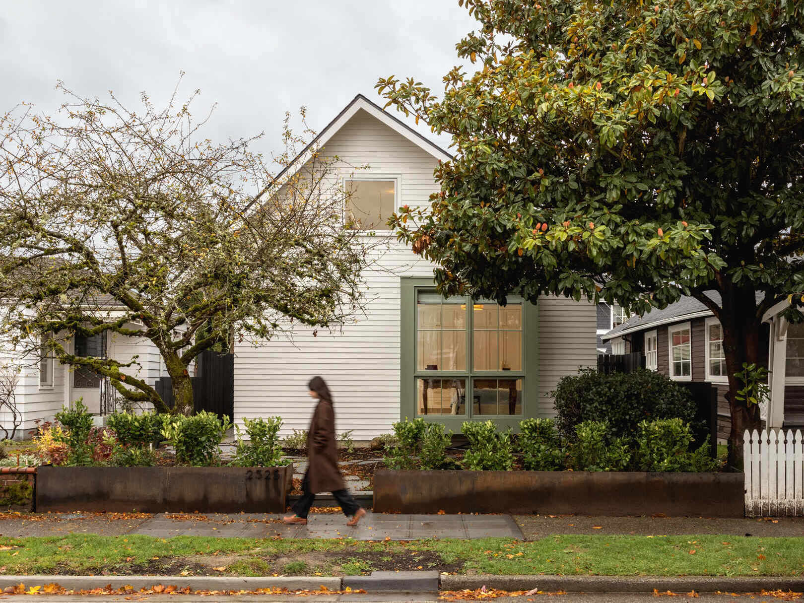 See how a bold gable roof, lofted spaces, and thoughtful planning turn a small Seattle lot into a timeless home with modern function.