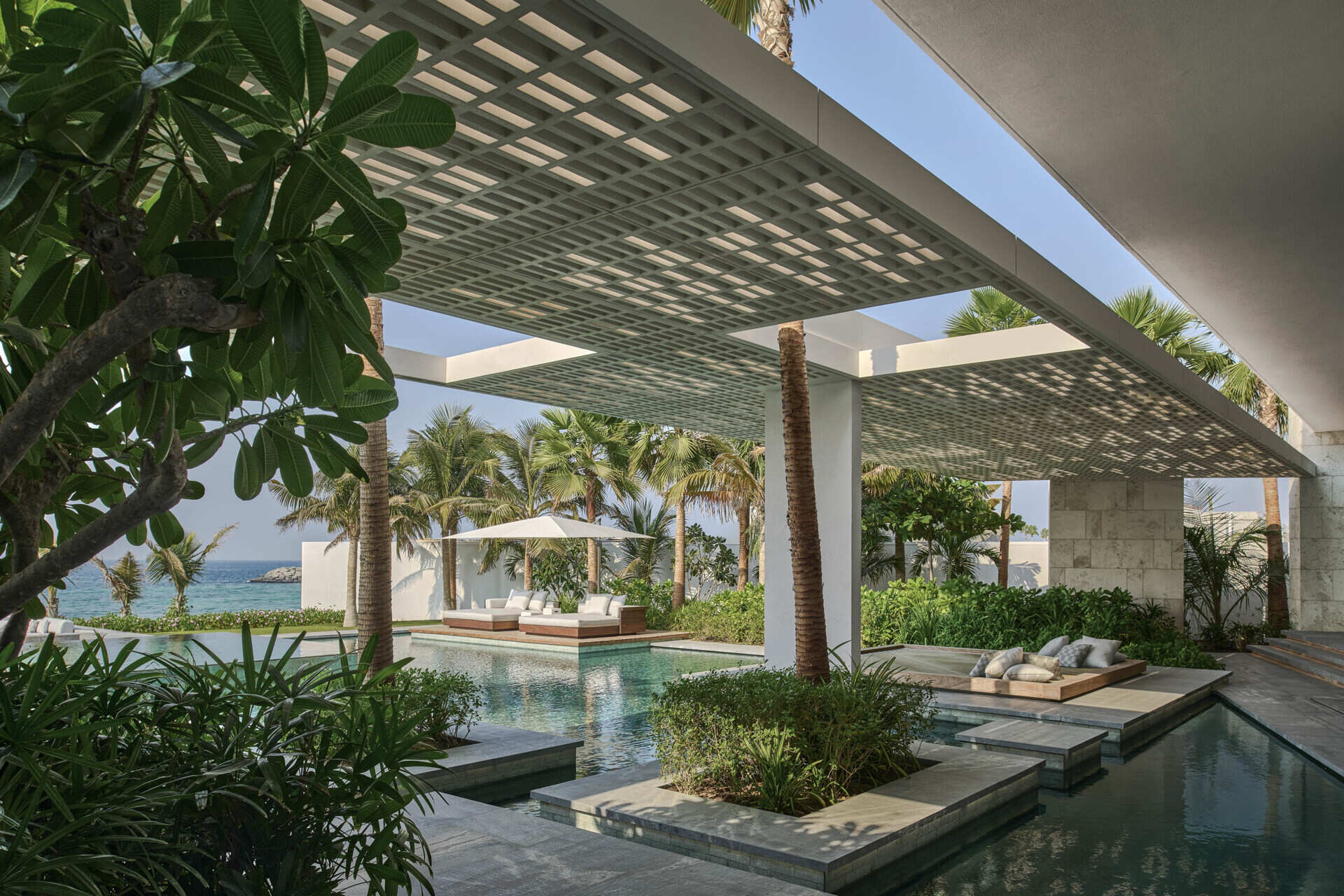 Island Villa in Dubai redefines urban coastal living by opening fully to the Arabian Sea while carefully managing privacy, light and climate. Designed by SAOTA with interiors by ARRCC, the home balances transparency with restraint along the constructed shoreline.