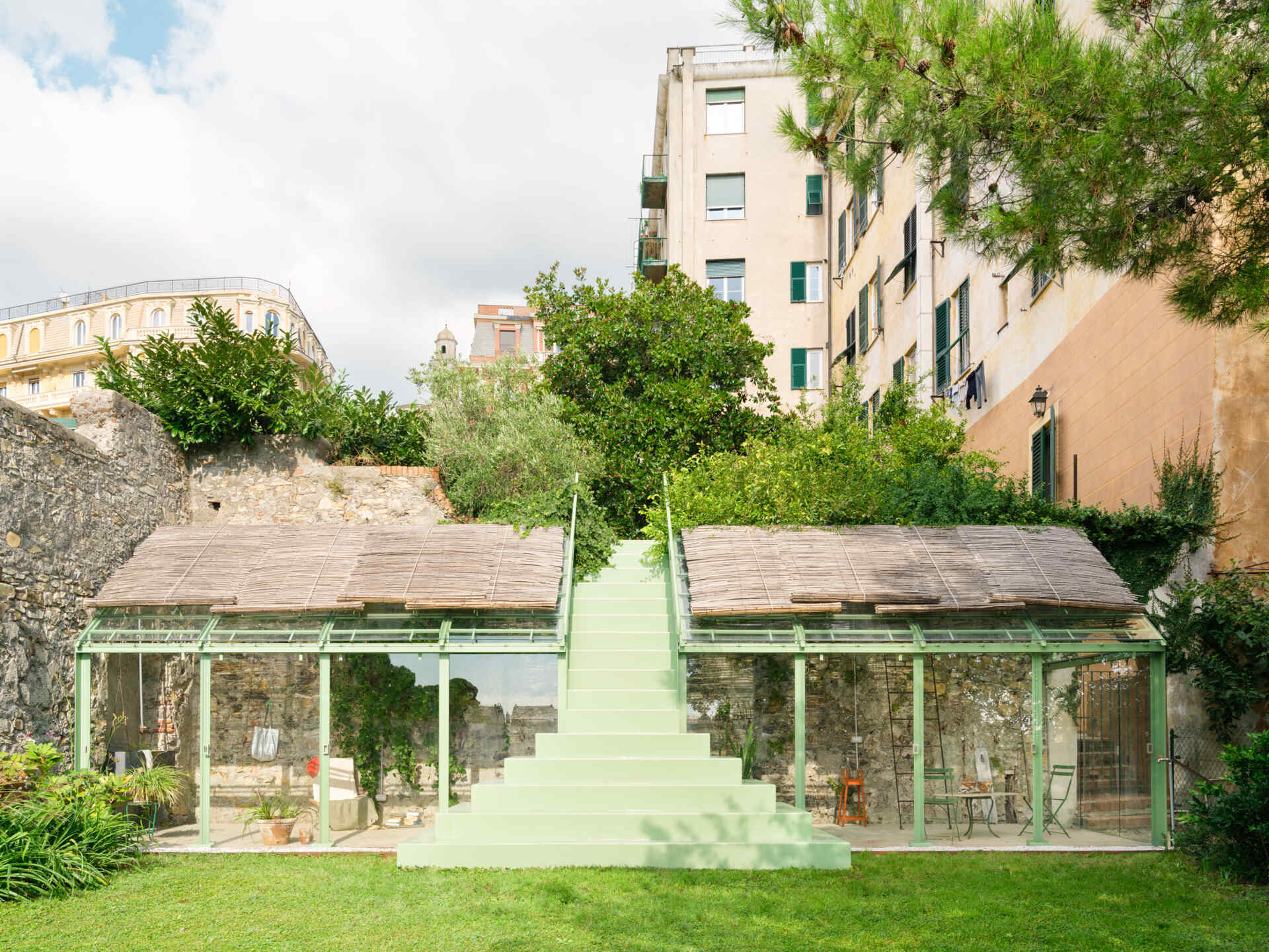 Discover how a simple change in elevation inspired a sculptural staircase and greenhouse that bring fresh architectural character to a private garden in Genoa.
