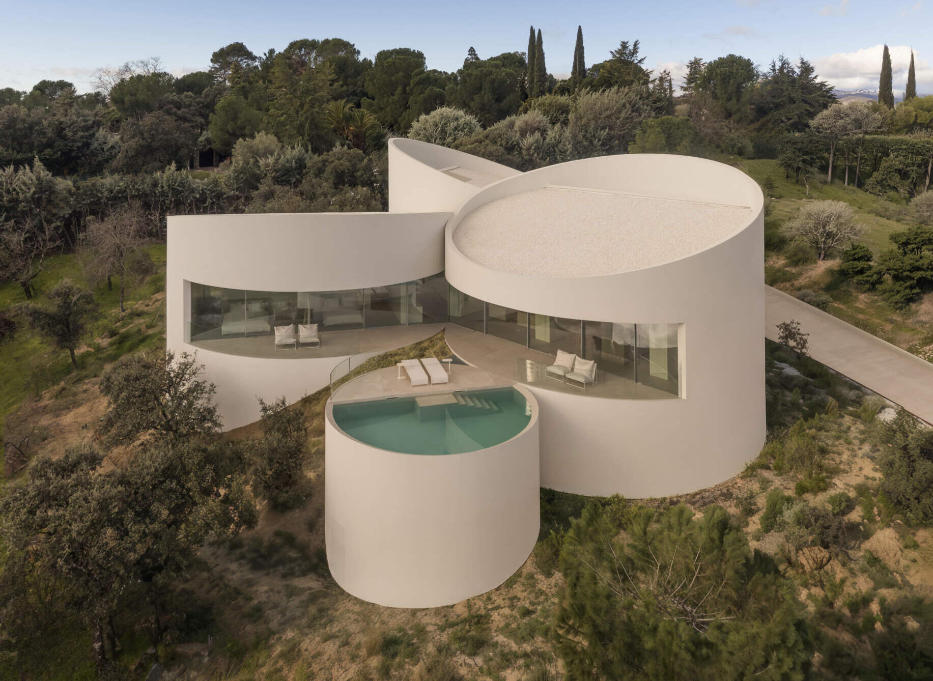 Explore how five curved volumes and an unusual floor plan combine to create one of Madrid's most distinctive contemporary homes.