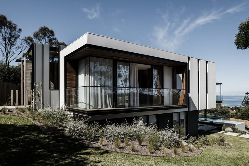 Explore this modern Mount Eliza home by Megowan Architectural, where timber, concrete and dramatic ocean views come together across a series of light-filled living spaces.