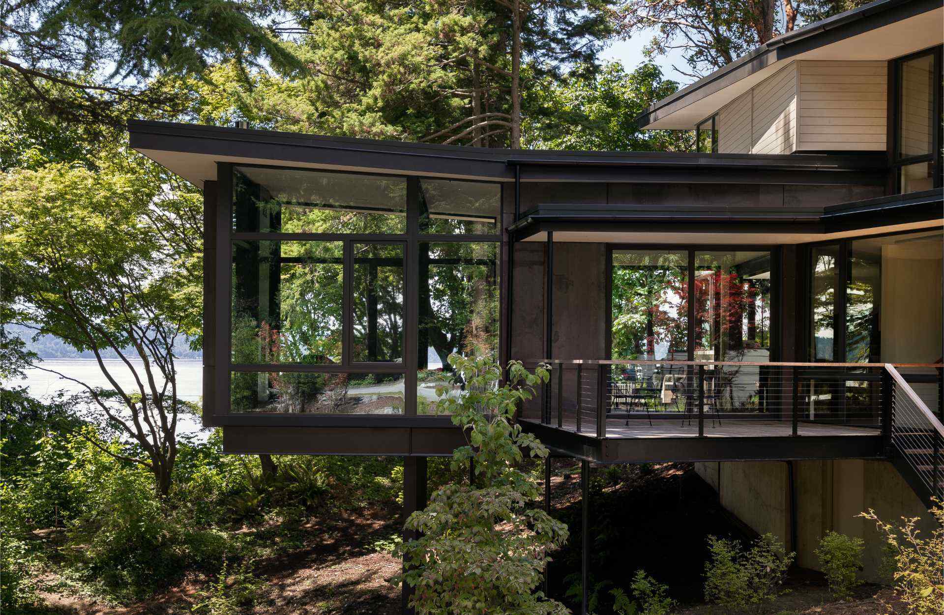 Explore a modern forest home in Burien, Washington, where architecture and interiors create the feeling of walking through the woods